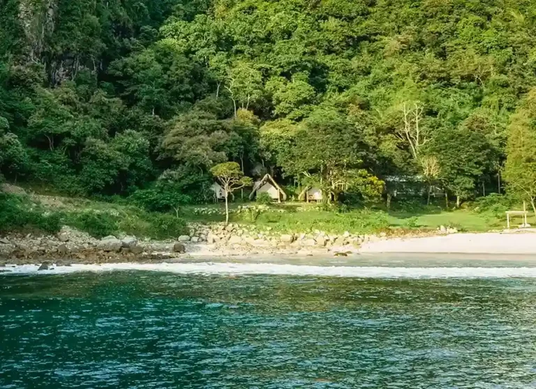 Kirana bamboo huts at dusk
